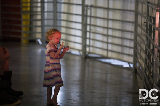 A young fan enjoying a concert.