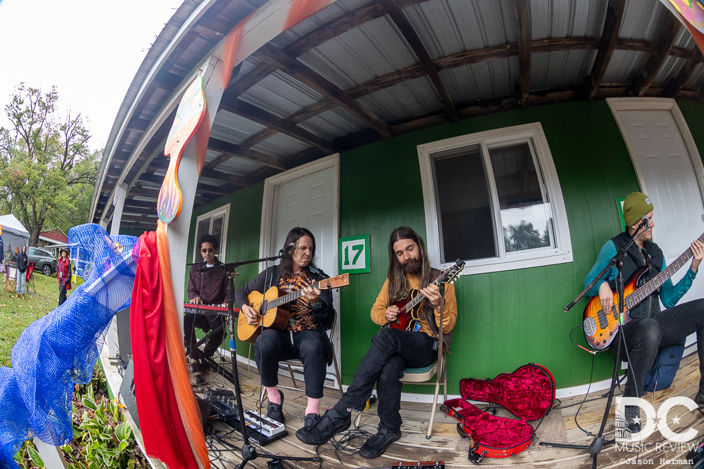 Magic Beans perform a secret acoustic set in front of their cabin Magic Beans perform a secret acoustic set in front of their cabin