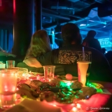 A couple watching the band from a festive table