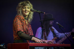 Natalie Brooke playing keyboard