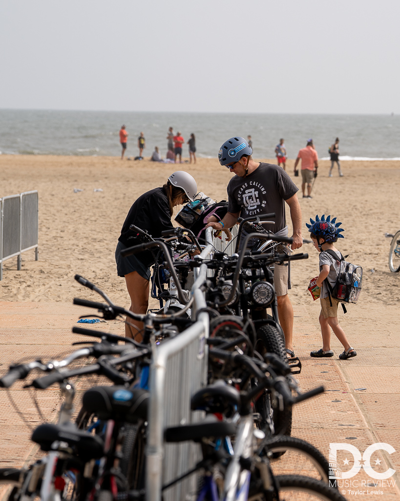 People enjoying the boardwalk of Ocean City, MD