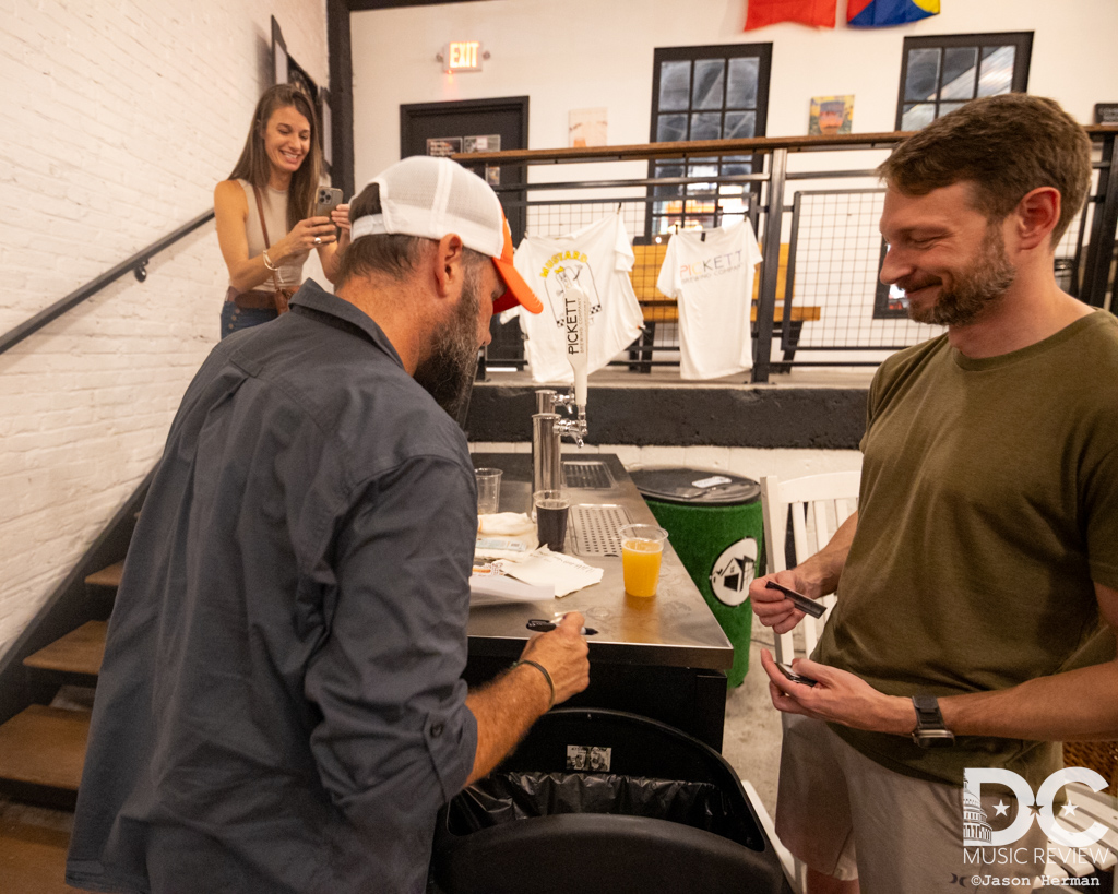 Tim Newby signs his latest book for a long line of fans