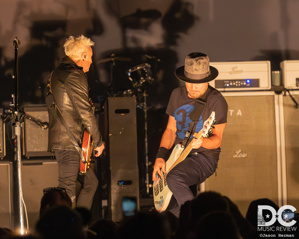 Mike McCready and Jeff Ament rocking out together on stage